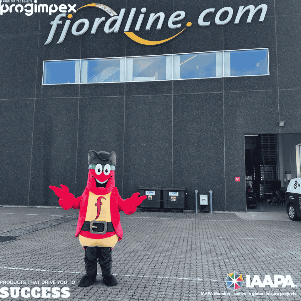 Fjordy, Fjord Line’s red lobster character, recreated as a full-size mascot and standing with open arms outside a Fjord Line building.
